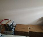 Kartony 21–30, Impresora en caja x 1, Olla express en caja x 1, Rower x 1, Bolsas azules de Ikea  x 